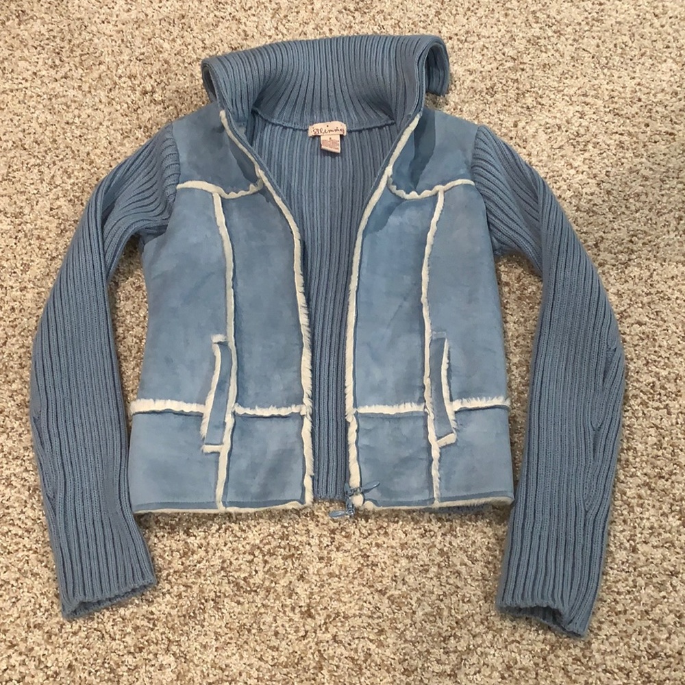 Fashionable blue sweater jacket with white piping.